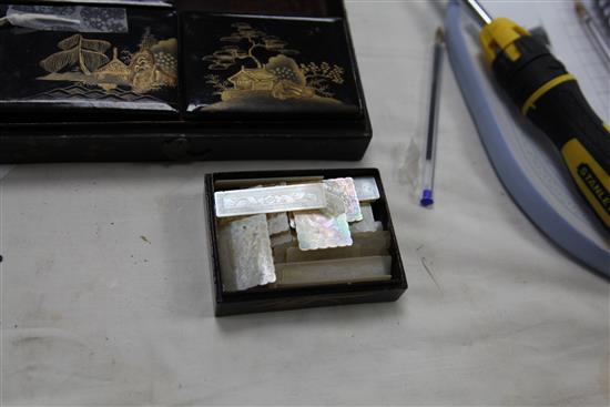 A collection of one hundred and fifty five mother of pearl gaming counters in a chinoiserie lacquered box, box. 8in.